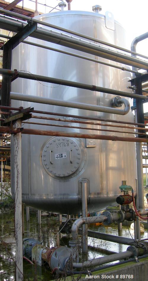 USED: Walker 3,500 gallon, type 304L stainless steel, storage tank. Vertical, dished heads. Approximate 8' diameter x 10' straight side. Misc top and side flanged openings. Side openings include an 1...