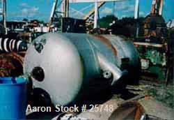 Used Wyatt Pressure Tank, 1590 Gallon, 304L Stainless Steel, Vertical. 60" diameter x 123" straight side, dished top and bottom. Internal rated 400 psi at 212 deg F. Openings: top (3) 4", 1-1/2"; bot...