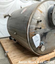 Used- 1200 Gallon Stainless Steel Tank, Vertical. Approximate 66" diameter x 80" deep. Dished top & bottom heads. Openings t...