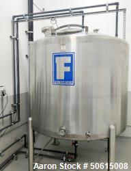 Used- Feldmeier 1500 Gallon Stainless Steel Tank, Vertical. Dished top and bottom; Top manway cover; Center bottom outlet; B...
