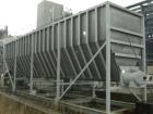Used: Moon Fabricators 316 stainless steel tank, rectangular, with bottom screw conveyor discharge. Year 2000, serial #B-8025. With 1,000 gallon stainless steel tank.