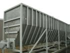 Used: Moon Fabricators 316 stainless steel tank, rectangular, with bottom screw conveyor discharge. Year 2000, serial #B-8025. With 1,000 gallon stainless steel tank.