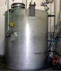 Used Tank, 3,000 gallon, Stainless steel, vertical.  Flat top, sloped bottom - full drain; UL listed aboveground tank for flammable liguids.  Tank Accessories: Protectoseal manhole & emergency pressu...