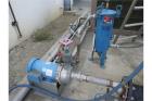 Used Tank, Approximately 1,000 Gallon, Stainless steel.  Used as a Chilled water tank, 6' dia, 5' high, with connectingpumps