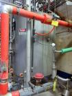 Used 1200 Gallon Stainless Steel Tank, Vertical. Approximate 66