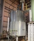 Used Approximate 4750 gallon Stainless Steel Agitated Tank With 5 HP Centrifugal Pump, V-4781. Top entering agitator (HP unknown). Cone bottom with center bottom outlet. Side bottom manway.