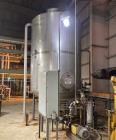 Used Approximate 4000 gallon Stainless Steel Storage Tank With 7.5 HP Centrifugal Pump, V-4782.  Misc. top inlets. Cone bottom with center bottom outlet. Bottom side manway. With 7.5 HP stainless ste...