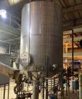 Used Approximate 4000 gallon Stainless Steel Storage Tank With 7.5 HP Centrifugal Pump, V-4782.  Misc. top inlets. Cone bottom with center bottom outlet. Bottom side manway. With 7.5 HP stainless ste...