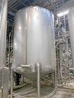 Used Stainless Steel Jacketed Tank, Approximate 2,500 Gallon.  Vertical, dish top, cone bottom, center bottom outlet, on (4) stainless steel legs.