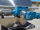 Unused 2,000 Gallon Vertical Stainless Steel Agitated Tank. Dished top and bottom. Stainless steel top agitator bridge with counter rotating side scrape agitation. Top manway. Center bottom outlet. M...