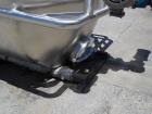 Unused 2,000 Gallon Vertical Stainless Steel Agitated Tank. Dished top and bottom. Stainless steel top agitator bridge with counter rotating side scrape agitation. Top manway. Center bottom outlet. M...