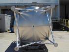 Unused 2,000 Gallon Vertical Stainless Steel Agitated Tank. Dished top and bottom. Stainless steel top agitator bridge with counter rotating side scrape agitation. Top manway. Center bottom outlet. M...