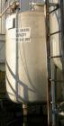 USED: Approximate 1000 gallon stainless steel storage tank. Approximately 55