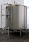 Used Cherry Burrell Tank, 2000 Gallon, 304 Stainless Steel, Vertical. 84” Diameter x 81” straight side, dished top, sloped bottom. (1) Spray ball, external side ladder. Openings: top (2) 2”, 3”, 3