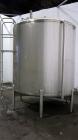 Used Cherry Burrell Tank, 2000 Gallon, 304 Stainless Steel, Vertical. 84” Diameter x 81” straight side, dished top, sloped bottom. (1) Spray ball, external side ladder. Openings: top (2) 2”, 3”, 3