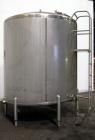 Used Cherry Burrell Tank, 2000 Gallon, 304 Stainless Steel, Vertical. 84” Diameter x 81” straight side, dished top, sloped bottom. (1) Spray ball, external side ladder. Openings: top (2) 2”, 3”, 3