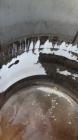 Used Cherry Burrell Tank, 2000 Gallon, 304 Stainless Steel, Vertical. 84” Diameter x 81” straight side, dished top, sloped bottom. (1) Spray ball, external side ladder. Openings: top (2) 2”, 3”, 3