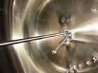 Used Cherry Burrell 2,000 Gallon Top Agitated Mixing Tank, Model CV.  304 Stainless steel mixing tank with (4) stainless steel legs.  Approximately 7' diameter x 6'6