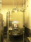 Used Cherry Burrell 2,000 Gallon Top Agitated Mixing Tank, Model CV.  304 Stainless steel mixing tank with (4) stainless steel legs.  Approximately 7' diameter x 6'6