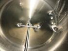 Used Cherry Burrell 2,000 Gallon Top Agitated Mixing Tank, Model CV.  304 Stainless steel mixing tank with (4) stainless steel legs.  Approximately 7' diameter x 6'6