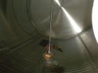 Used Cherry Burrell Storage Tank, 3000 gallon, 304 stainless steel, horizontal. 84'' diameter x 108'' straight side, dished heads. Insulated with carbon steel sheathing. 1/4 channel jacket on partial...