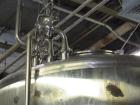 Used Cherry Burrell Stainless Steel Tank with  5 hp side agitator, 8' straight wall, 9' diameter, 15' overall length, domed top/bottom, (6) stainless steel legs, top and front manways, center bottom ...