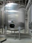 Used Cherry Burrell Stainless Steel Tank with  5 hp side agitator, 8' straight wall, 9' diameter, 15' overall length, domed top/bottom, (6) stainless steel legs, top and front manways, center bottom ...