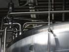 Used Cherry Burrell Stainless Steel Tank with  5 hp side agitator, 8' straight wall, 9' diameter, 15' overall length, domed top/bottom, (6) stainless steel legs, top and front manways, center bottom ...