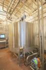 Used DCI 2,000 Gallon Stainless Steel Single Wall Mix Tank, Vertical. Dome Top/Cone Bottom. Top mounted agitation with bottom sweep blade and motor. Top entering baffle. Dual CIP Spray Ball. Mounted ...