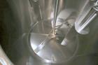 Used DCI 2,000 Gallon Stainless Steel Single Wall Mix Tank, Vertical. Dome Top/Cone Bottom. Top mounted agitation with bottom sweep blade and motor. Top entering baffle. Dual CIP Spray Ball. Mounted ...