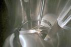 Used DCI 2,000 Gallon Stainless Steel Single Wall Mix Tank, Vertical. Dome Top/Cone Bottom. Top mounted agitation with bottom sweep blade and motor. Top entering baffle. Dual CIP Spray Ball. Mounted ...