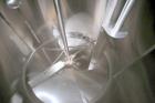 Used DCI 2,000 Gallon Stainless Steel Single Wall Mix Tank, Vertical. Dome Top/Cone Bottom. Top mounted agitation with bottom sweep blade and motor. Top entering baffle. Dual CIP Spray Ball. Mounted ...