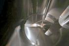 Used DCI 2,000 Gallon Stainless Steel Single Wall Mix Tank, Vertical. Dome Top/Cone Bottom. Top mounted agitation with bottom sweep blade and motor. Top entering baffle. Dual CIP Spray Ball. Mounted ...