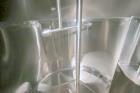 Used DCI 2,000 Gallon Stainless Steel Single Wall Mix Tank, Vertical. Dome Top/Cone Bottom. Top mounted agitation with bottom sweep blade and motor. Top entering baffle. Dual CIP Spray Ball. Mounted ...