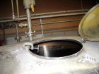 Used Ertel Tank, 2000 gallon, stainless steel, vertical. Approximately 80