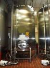 Used Feldmeier Tank, 3,000 Gallons, 304 Stainless Steel, Vertical.  Dish top and bottom with side manway.  Top mounted off-center agitator 60 hz, 480 volt.  Slow speed inlets, sight glass.  3