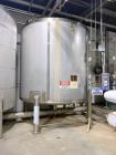 Used Feldmeier Stainless Steel Tank, Approximate 4,700 gallon. Vertical, slight dished top and bottom, center bottom outlet, on (4) stinless steel legs.