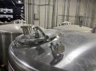 Used Tank, Feldmeier 1,000 Gallon, Stainless steel. Dish top, Cone Bottom, On casters with bottom discharge valve.