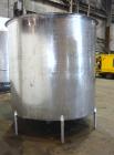 Used Filpaco Tank, 2000 Gallons, 304 Stainless Steel, Vertical. Approximate 86” Diameter X 81” straight side, open top with (2) covers, sloped bottom. Side bottom entering agitator with a (3) blade p...