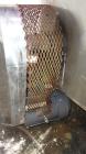Used Filpaco Tank, 2000 Gallons, 304 Stainless Steel, Vertical. 86” Diameter X 84” straight side, open top with (2) covers, cone bottom. Side bottom entering agitator with a (3) blade prop driven by ...