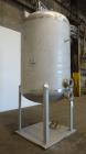 Used Four Corp Pressure Tank, Approximately 1,250 Gallon, 304 Stainless Steel.