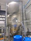 Used Glacier Tanks Stainless Steel Brew Tank, 40 BBL (1,240 Gallon). 304 stainless steel. Cone bottom. Center bottom outlet. Side manway. On (4) legs. SN GT-V-3215.