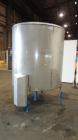 Used Mueller Tank, 1000 Gallons, 304 Stainless Steel, Vertical. 67” Diameter x 70” straight side, Open top with (2) covers, sloped bottom. Side bottom entering agitator with (3) blade prop driven by ...