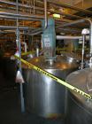 Used Mueller Tank, 2000 Gallon, Model F, stainless steel, vertical. 76