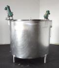 Used Mueller Tank, 1000 Gallon, 316 Stainless Steel, Vertical. Approximate 76” diameter x 57” straight side, open top with (2) covers, sloped bottom. (2) Lightnin clamp on agitators. (1) Model XJ-65V...
