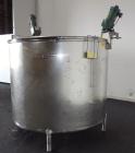 Used Mueller Tank, 1000 Gallon, 316 Stainless Steel, Vertical. Approximate 76” diameter x 57” straight side, open top with (2) covers, sloped bottom. (2) Lightnin clamp on agitators. (1) Model XJ-65V...