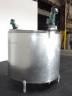 Used Mueller Tank, 1000 Gallon, 316 Stainless Steel, Vertical. Approximate 76” diameter x 57” straight side, open top with (2) covers, sloped bottom. (2) Lightnin clamp on agitators. (1) Model XJ-65V...