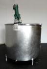 Used Mueller Tank, 1000 Gallon, 316 Stainless Steel, Vertical. Approximate 76” diameter x 57” straight side, open top with (2) covers, sloped bottom. (2) Lightnin clamp on agitators. (1) Model XJ-65V...