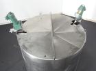 Used Mueller Tank, 1000 Gallon, 316 Stainless Steel, Vertical. Approximate 76” diameter x 57” straight side, open top with (2) covers, sloped bottom. (2) Lightnin clamp on agitators. (1) Model XJ-65V...