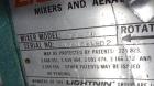 Used Mueller Tank, 1000 Gallon, 316 Stainless Steel, Vertical. Approximate 76” diameter x 57” straight side, open top with (2) covers, sloped bottom. (2) Lightnin clamp on agitators. (1) Model XJ-65V...